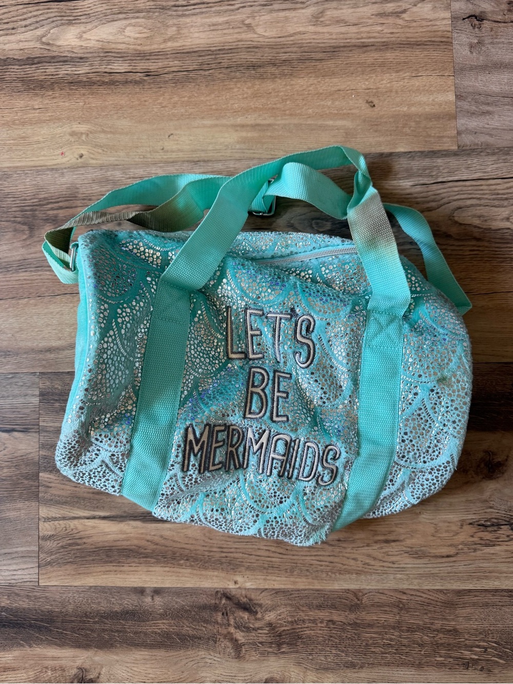 Turquoise "Let's Be Mermaids" Women’s Duffel Bag with stain on straps